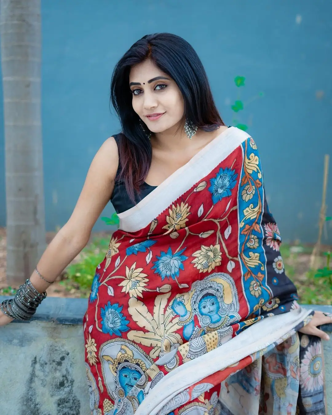 Vasanthi Krishnan Wearing Red Saree Blue Sleeveless Blouse